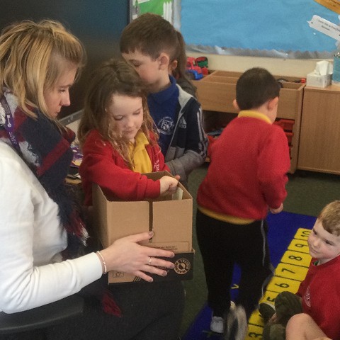 Year 1 putting something happy in the happiness box